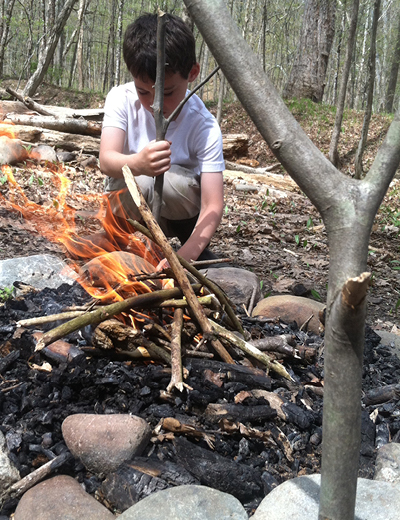 Flying Deer Nature Center | 2 Boy lighting a Campfire